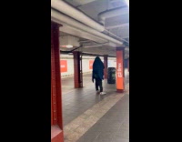Guy covered with blue blanket charge subway