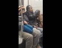 Lady on subway eats sandwich