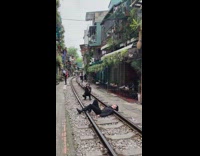 Guy black shirt lay on train tracks