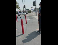 Red hat guy dances outside randys donuts