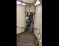 Guy kicks trash at rat on step 