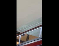 Guy on escalator with middle finger mask