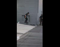 Guy falls backward on skateboard rail