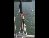 Man shirtless selfie monopod photo shoot boat ocean