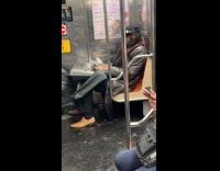 Man ride subway train play keyboard instrument