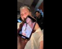 Girl recording herself turns around waves 