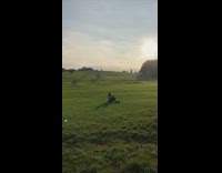 Girl grey coat sit grass take selfie