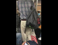 Guy riding subway plays air drums dances 