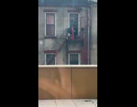 Guy cleans red leg at fire escape