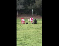 Woman red pants white skirt tumble park