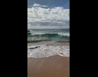 Kid surfing on boogie board wiped out by waves