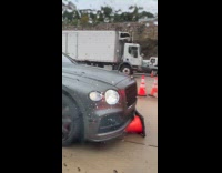 Traffic cone stuck under the car bumper
