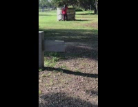 Red sweater girl dances cement cylinder park 