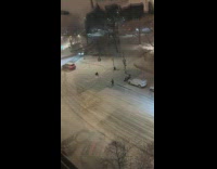 Two guys pulled by truck on snow