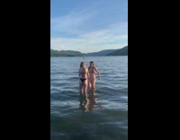 Woman bikini double middle finger from beach