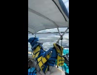 Guy on jetski goes airborne riding on and jumping over small dock 
