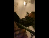 Guy slides down stair rail and falls
