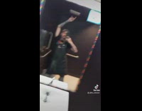 Guy black shirt in bathroom beatboxing turns on water faucet