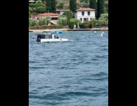 Boat looks like white jeep sail on water