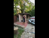 Guy uses beer bottle to open beer 