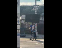 Cyclist with flat screen tv on head