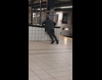 Guy do push ups at the train station subway 