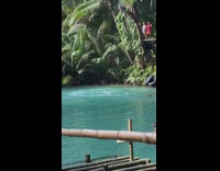 Woman lets go of water swing 