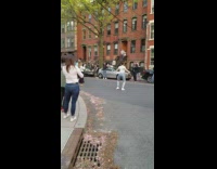 Guy sing girl white shirt dance street