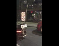 Two guys ride toys on street