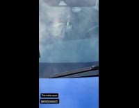 Blue damaged car parked on the street