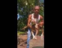 Collab ClipsIG - Guy pretends to strum dog while other dog bites and spins on rope