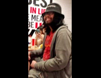 Man grab some money inside his broken shoes