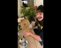 Man sings while jokes about hand with pizza cutter