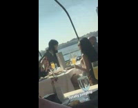 White shirt girl poses with mimosa glass 