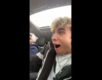 Snowball falls through open sunroof hits guy 