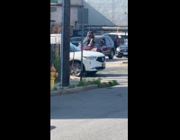Man sit twerk dance on car windshield