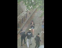 Guy walk music video shoot throw money