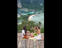 Four people picnic jam session for video