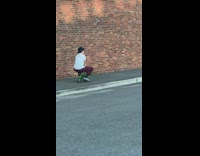 Guy rides small mini toy green bicycle 