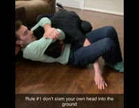 Guy slams head against floor while wrestling 