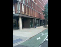 Collab WINY - Man rides bicycle balances piano on head