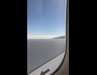 Visible air vortices trail on airplane wing