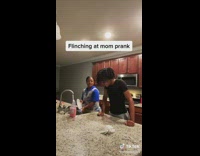 Son pranks mom washing dishes and gets punished with water and soap