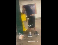 Guy squirts hand sanitizer onto arms station 