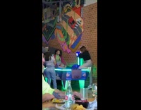 girl sits air hockey table 