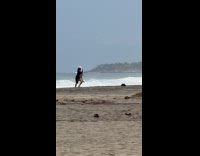 Woman black bikini pink hat beach tiktok