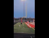 Guy kicks through side of goal post