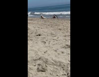 Camera guy bend over white hat dog