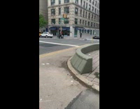 Guy drives remote control car on the street