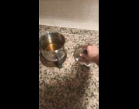 Guy pulls pot lid without touching it 